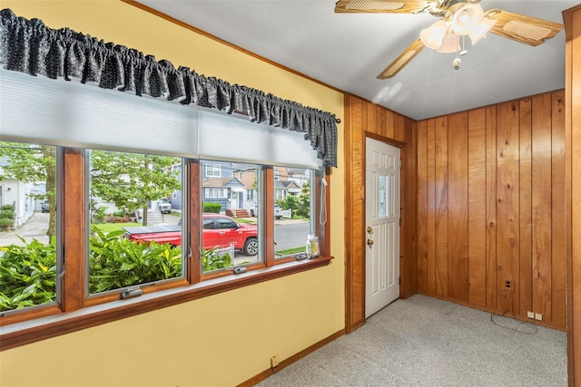 72 Putnam Ave, Valley Stream, NY 11580 - carpeted empty room with wood walls and ceiling fan