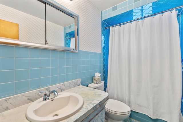 72 Putnam Ave, Valley Stream, NY 11580 - bathroom featuring tile walls, vanity, and shower / bath combo with shower curtain