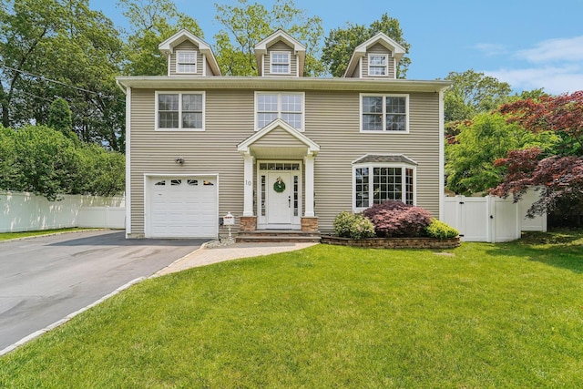 10 Willow Dr, Suffern, NY 10901 - view of front of house featuring driveway, an attached garage, and a gate