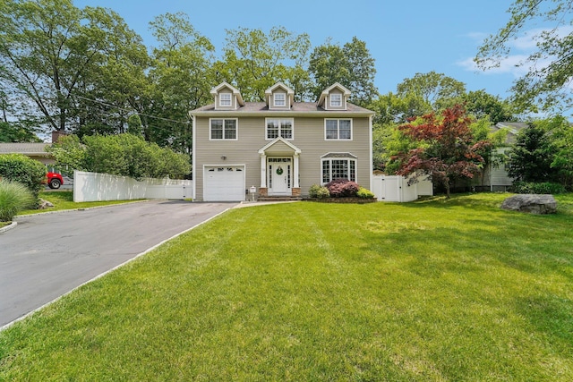 10 Willow Dr, Suffern, NY 10901 - colonial inspired home featuring asphalt driveway and an attached garage