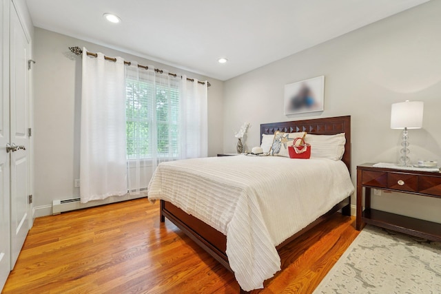10 Willow Dr, Suffern, NY 10901 - bedroom featuring wood finished floors, baseboard heating, and recessed lighting