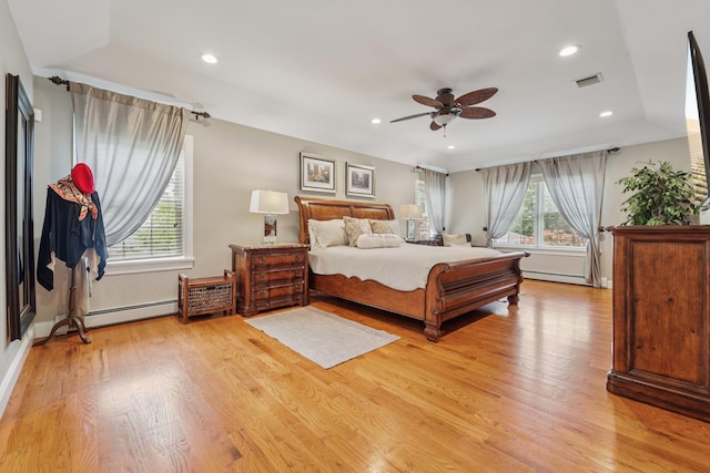 10 Willow Dr, Suffern, NY 10901 - bedroom featuring multiple windows, light wood-style floors, a baseboard radiator, recessed lighting, and a ceiling fan