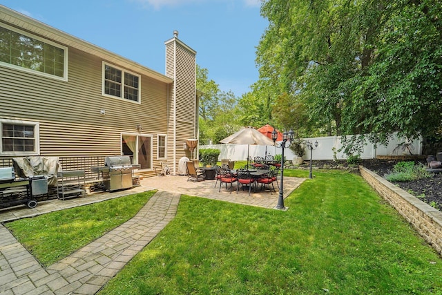 10 Willow Dr, Suffern, NY 10901 - back of house featuring a chimney, a fenced backyard, and a patio area