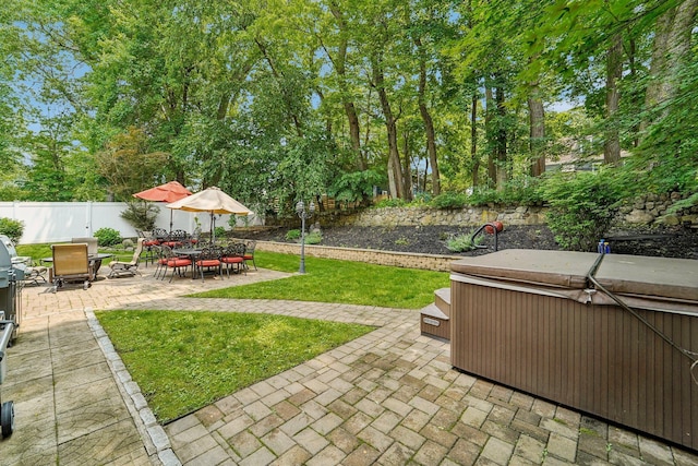 10 Willow Dr, Suffern, NY 10901 - fenced backyard with a hot tub, a patio area, and outdoor dining space