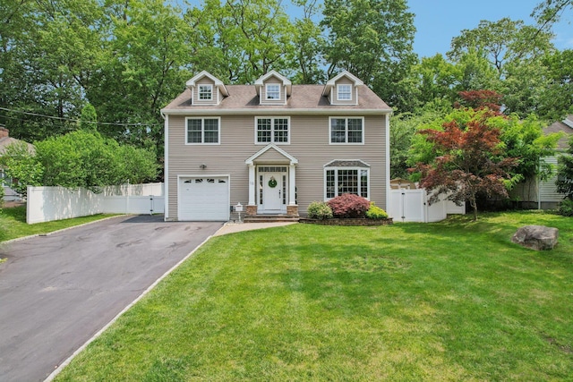 10 Willow Dr, Suffern, NY 10901 - colonial house with driveway, a garage, and a gate