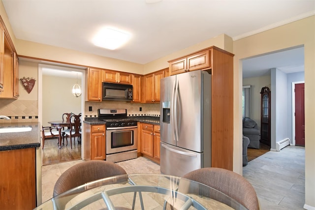 27 Temple Rd, Dobbs Ferry, NY 10522 - kitchen with appliances with stainless steel finishes, decorative backsplash, baseboard heating, brown cabinetry, and ornamental molding