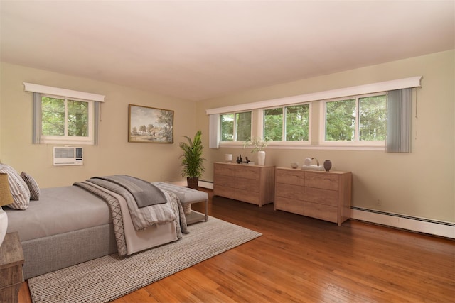 27 Temple Rd, Dobbs Ferry, NY 10522 - bedroom with baseboard heating, wood finished floors, and a wall mounted air conditioner