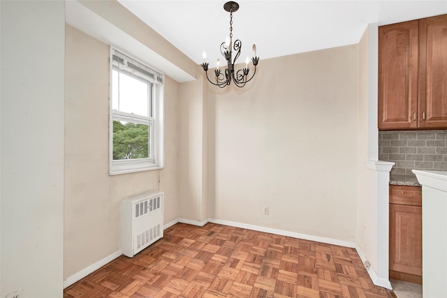 33 Barker Ave Unit 6K, White Plains, NY 10601 - unfurnished dining area with radiator and a chandelier