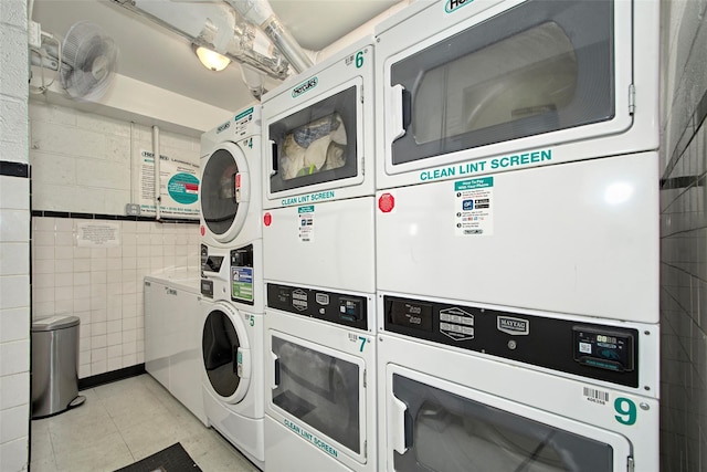 33 Barker Ave Unit 6K, White Plains, NY 10601 - shared laundry featuring stacked washer and clothes dryer, washer and dryer, and tile walls