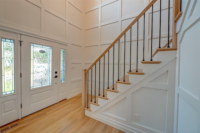 100 Root Ave, Islip, NY 11751 - entrance foyer featuring a decorative wall, stairs, and light wood-style flooring