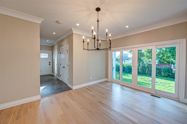 100 Root Ave, Islip, NY 11751 - unfurnished dining area with a chandelier, crown molding, wood finished floors, and recessed lighting