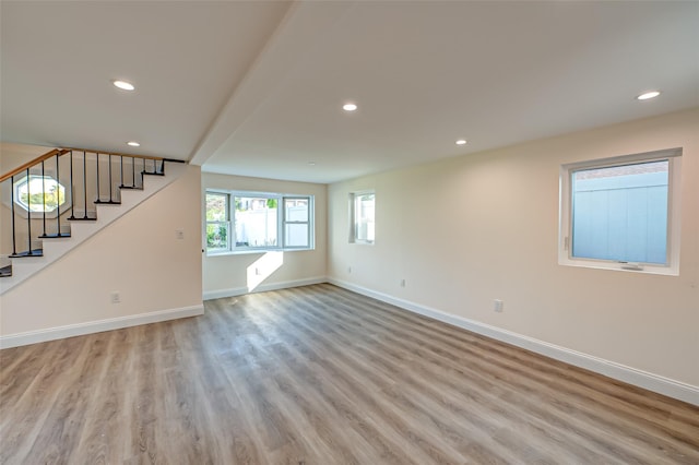 100 Root Ave, Islip, NY 11751 - unfurnished living room featuring light wood-style floors, recessed lighting, and stairway