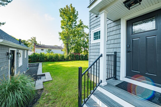100 Root Ave, Islip, NY 11751 - doorway to property featuring a lawn
