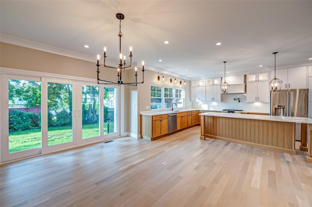 100 Root Ave, Islip, NY 11751 - kitchen with appliances with stainless steel finishes, custom range hood, a chandelier, light countertops, and recessed lighting