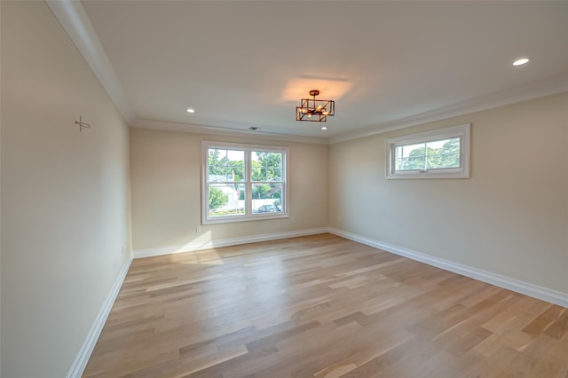 100 Root Ave, Islip, NY 11751 - empty room with healthy amount of natural light, light wood-type flooring, crown molding, a chandelier, and recessed lighting