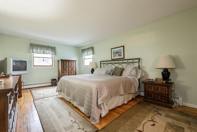 1581 Shirley Ct, North Merrick, NY 11566 - bedroom featuring a baseboard radiator and light wood-style flooring