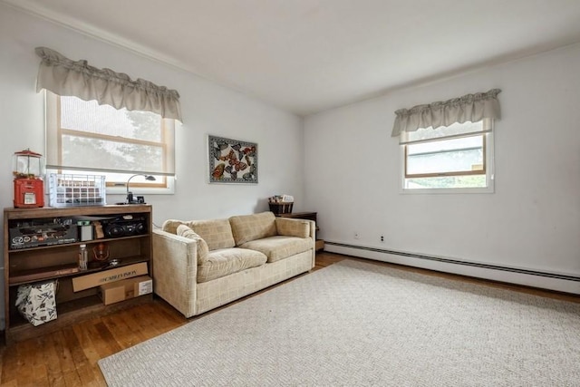 1581 Shirley Ct, North Merrick, NY 11566 - sitting room featuring a baseboard heating unit and wood finished floors