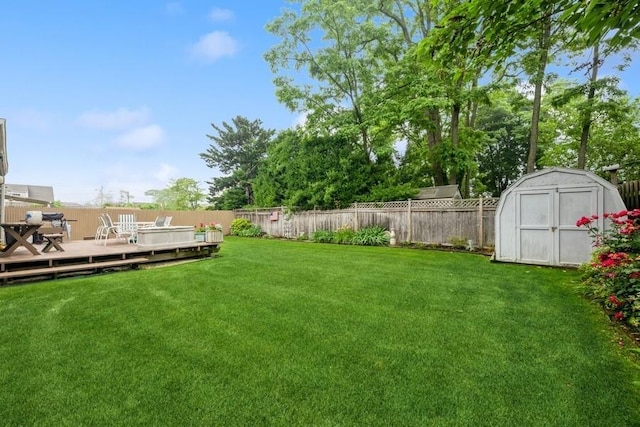 1581 Shirley Ct, North Merrick, NY 11566 - fenced backyard featuring a storage shed and a deck