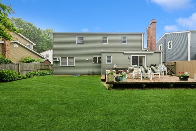 1581 Shirley Ct, North Merrick, NY 11566 - back of house featuring a fenced backyard, a wooden deck, and a chimney