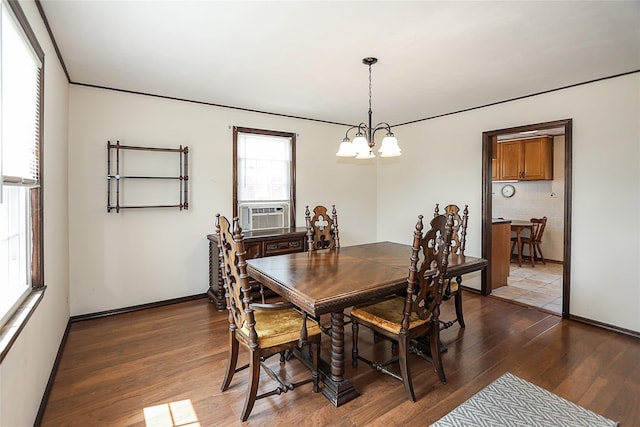 2199 Mcarthur St, East Meadow, NY 11554 - dining area with dark wood-style floors, a chandelier, and cooling unit