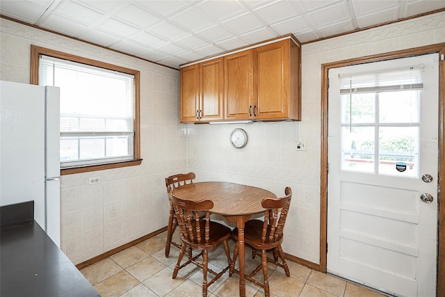 2199 Mcarthur St, East Meadow, NY 11554 - dining room with healthy amount of natural light and light tile patterned floors