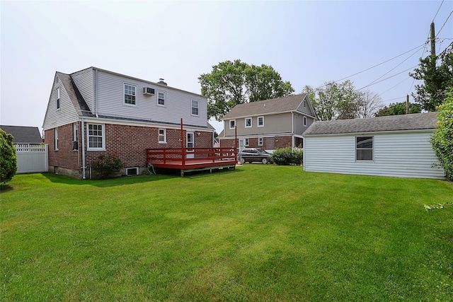 2199 Mcarthur St, East Meadow, NY 11554 - back of house featuring a yard, brick siding, and a deck
