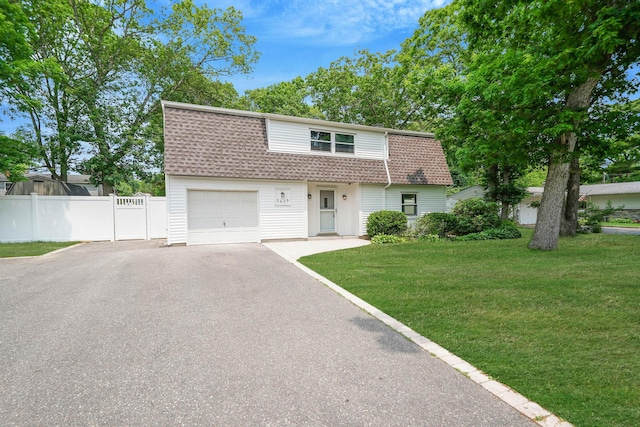 5439 Expressway Dr N, Holtsville, NY 11742 - dutch colonial featuring a shingled roof, asphalt driveway, and a garage