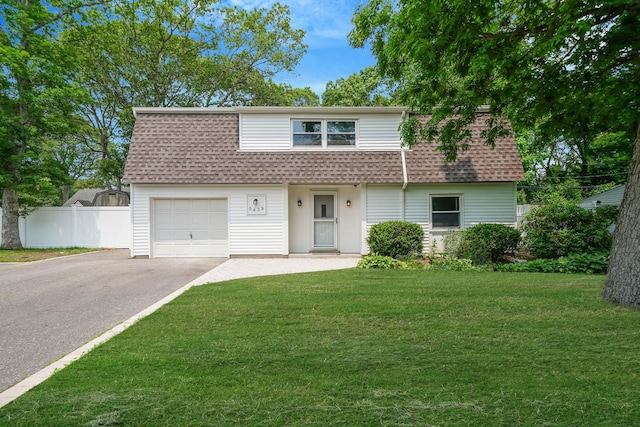 5439 Expressway Dr N, Holtsville, NY 11742 - view of front facade featuring a shingled roof, asphalt driveway, and an attached garage