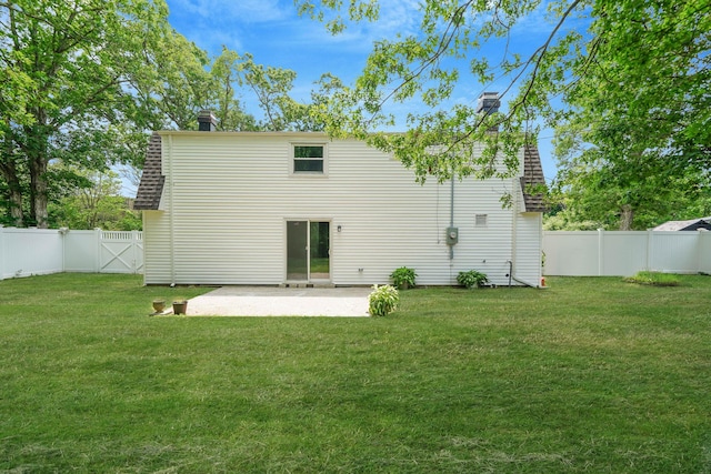 5439 Expressway Dr N, Holtsville, NY 11742 - rear view of house featuring a patio, a fenced backyard, roof with shingles, and a gate