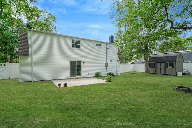 5439 Expressway Dr N, Holtsville, NY 11742 - rear view of property with a chimney, a storage shed, a patio, and a fenced backyard