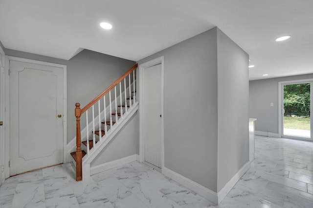 5439 Expressway Dr N, Holtsville, NY 11742 - staircase featuring marble look tile flooring and recessed lighting