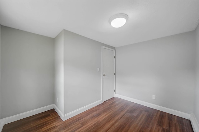 5439 Expressway Dr N, Holtsville, NY 11742 - unfurnished room with dark wood finished floors and baseboards