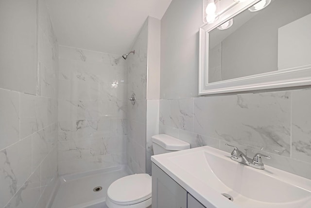 5439 Expressway Dr N, Holtsville, NY 11742 - bathroom with tile walls, a tile shower, and vanity