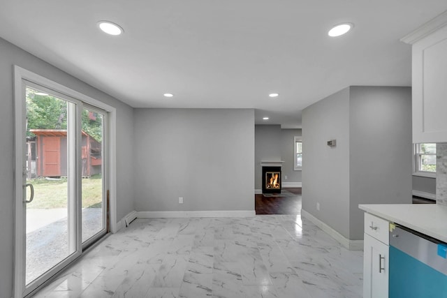 5439 Expressway Dr N, Holtsville, NY 11742 - kitchen featuring dishwasher, white cabinetry, recessed lighting, light countertops, and healthy amount of natural light