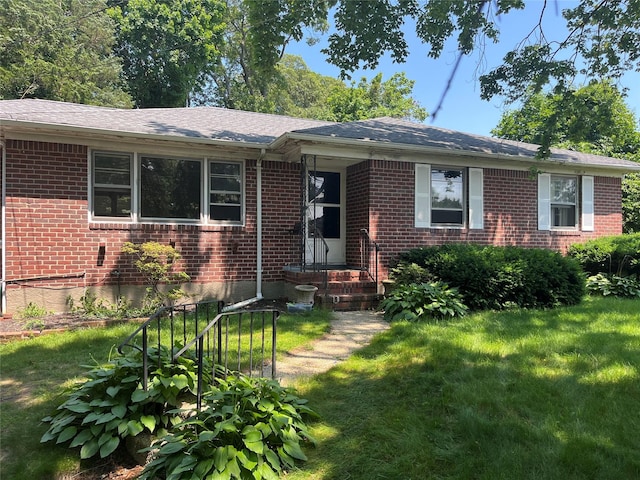 83 Bellerose Ave, East Northport, NY 11731 - view of front of property featuring brick siding, a front yard, and a shingled roof