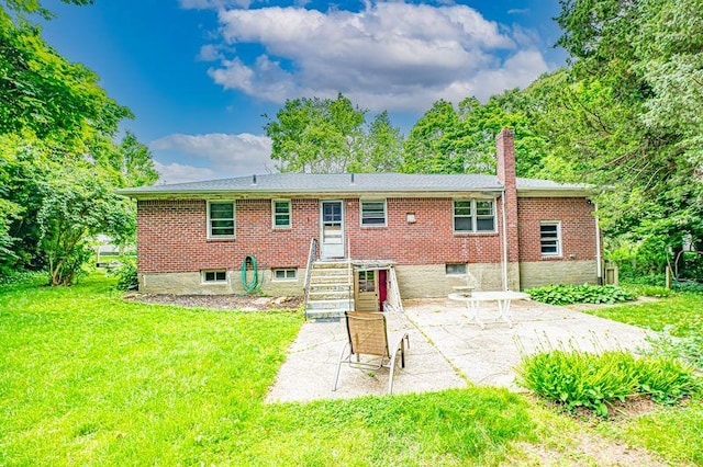 83 Bellerose Ave, East Northport, NY 11731 - rear view of property featuring a patio, a lawn, and a chimney