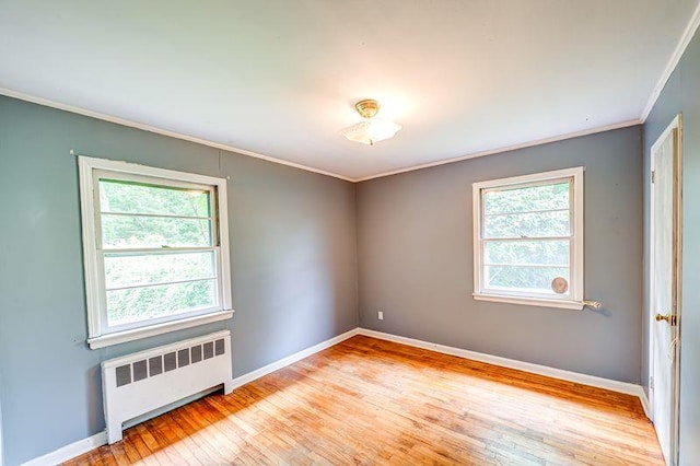 83 Bellerose Ave, East Northport, NY 11731 - empty room featuring radiator, crown molding, healthy amount of natural light, and wood finished floors