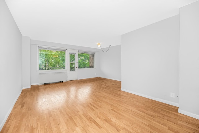 3777 Independence Ave Unit 3F, Bronx, NY 10463 - spare room featuring radiator heating unit and light wood-type flooring