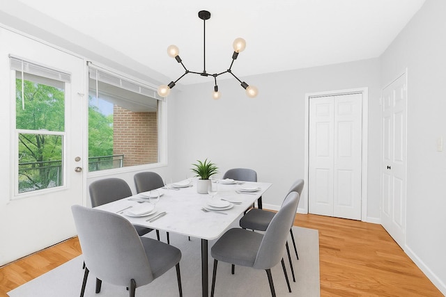 3777 Independence Ave Unit 3F, Bronx, NY 10463 - dining area featuring a chandelier and light wood-style floors