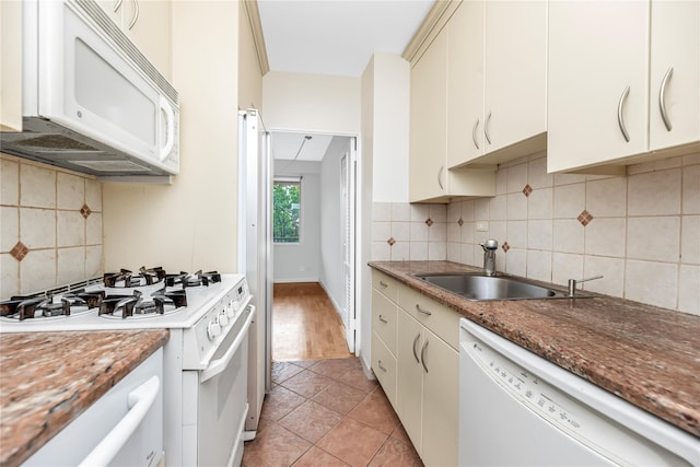 3777 Independence Ave Unit 3F, Bronx, NY 10463 - kitchen with white appliances, backsplash, and light tile patterned floors