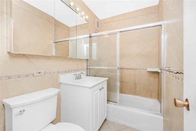 3777 Independence Ave Unit 3F, Bronx, NY 10463 - bathroom featuring vanity, shower / bath combination with glass door, and tile walls