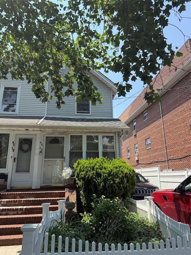 46-28 162nd St, Flushing, NY 11358 - view of front of house with a fenced front yard
