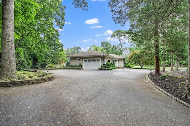 109 Oakside Dr, Smithtown, NY 11787 - view of front facade with a garage and driveway