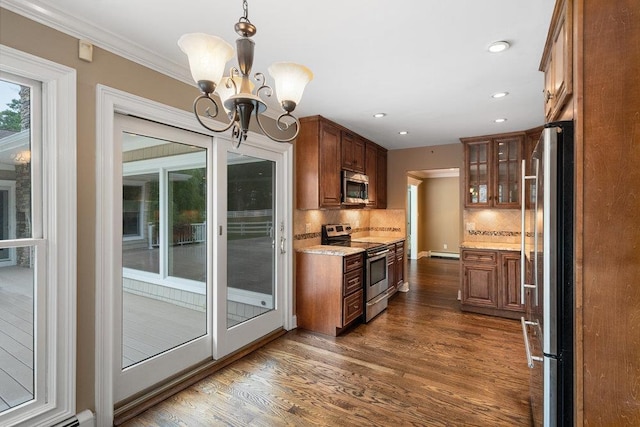 109 Oakside Dr, Smithtown, NY 11787 - kitchen with appliances with stainless steel finishes, a chandelier, dark wood-type flooring, backsplash, and recessed lighting