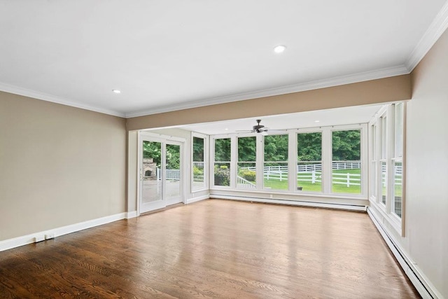 109 Oakside Dr, Smithtown, NY 11787 - unfurnished room with a baseboard heating unit, a ceiling fan, wood finished floors, crown molding, and recessed lighting