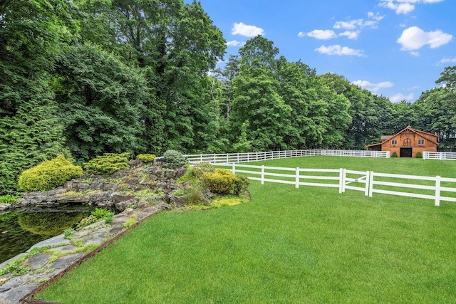109 Oakside Dr, Smithtown, NY 11787 - view of yard featuring a barn, an outbuilding, and a view of trees
