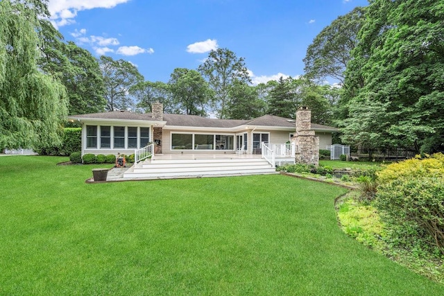 109 Oakside Dr, Smithtown, NY 11787 - rear view of house with a chimney, a sunroom, and a deck