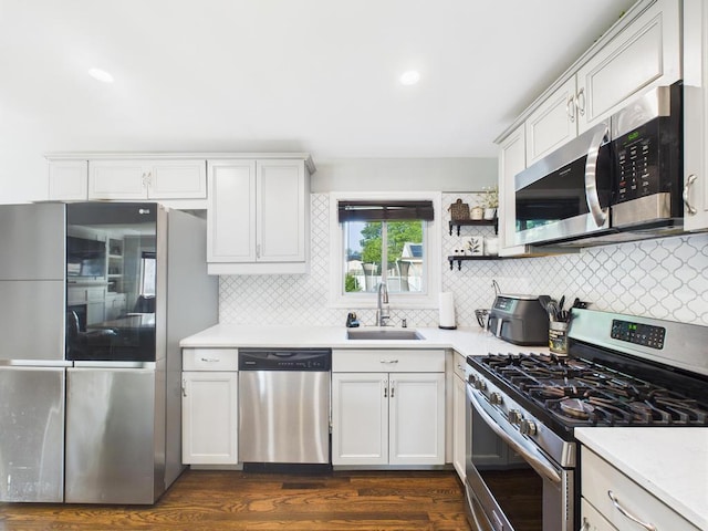 554 S 8th St, Lindenhurst, NY 11757 - kitchen featuring stainless steel appliances, light countertops, and backsplash