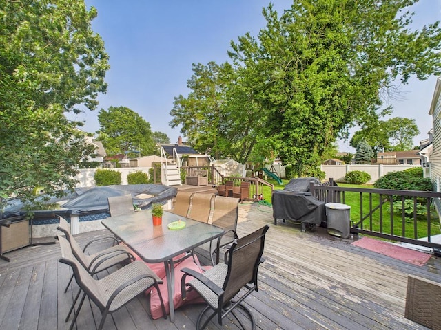554 S 8th St, Lindenhurst, NY 11757 - deck featuring outdoor dining area and a fenced backyard