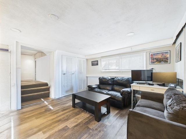 554 S 8th St, Lindenhurst, NY 11757 - living area featuring wood finished floors and stairs